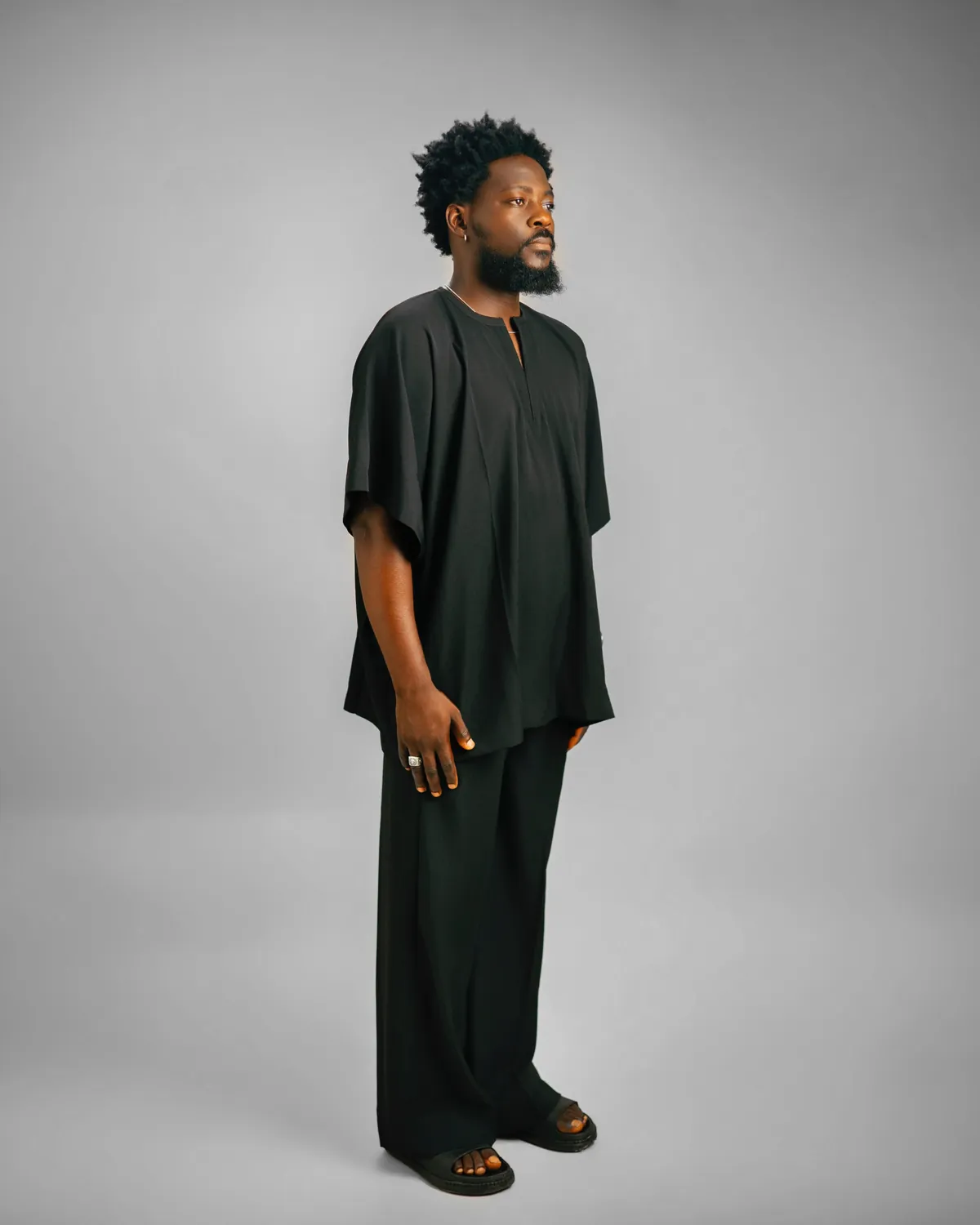 Black danshiki with matching wide trousers, studio portrait