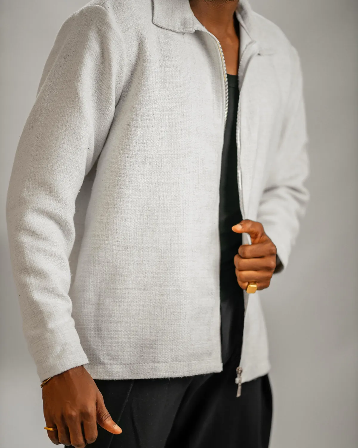 Ivory zip jacket by Tobby Vogue, worn by a model